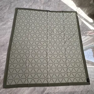 Woven jacquard throw blanket with geometric triangle pattern, soft airplane and car blanket.