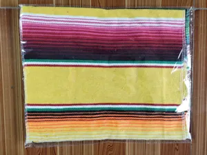 Detailed close-up view of the colorful Mexican striped woven blanket, showing fine texture.