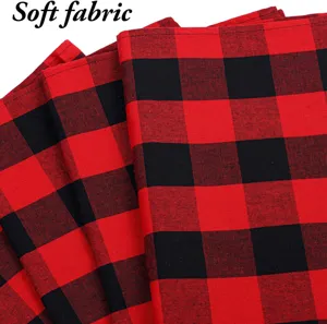 Close-up detail of red and black buffalo plaid fabric texture, soft textile material.