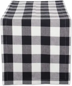 Black and white buffalo check pattern fabric detail, modern minimalist home textile decor.