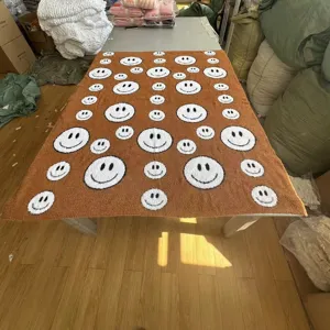 Brown knitted fleece blanket with white smiley face pattern, soft cozy throw for sofa bed home decor