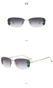 Lunettes de soleil carrées sans monture dégradées avec décor de feuilles vertes et métal.