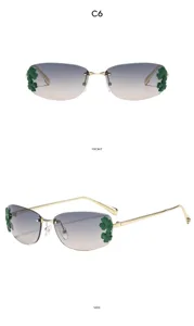 Lunettes de soleil carrées sans monture avec verres dégradés et décoration de feuilles.