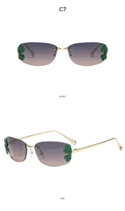 Vue détaillée de lunettes de soleil carrées en métal sans monture avec décorations de feuilles.