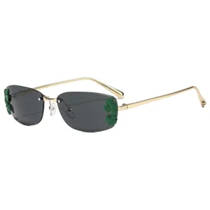 Lunettes de soleil métalliques carrées avec décor de feuilles vertes et style chic.