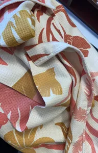 Soft microfiber beach towel with tropical botanical print, quick-drying and highly absorbent.