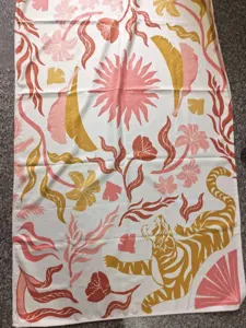 Closeup detail showing the fine texture and vintage botanical tiger print of the quick dry towel.