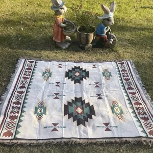 Bohemian geometric knitted throw blanket for sofa, couch cover, and multi-purpose table cloth.