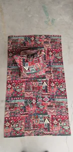 Detailed view of ethnic style jacquard fabric blanket rug and matching pillow set for home decor.