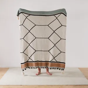 Knitted jacquard throw blanket with geometric pattern and tassels for sofa bed decor