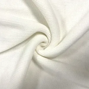White knitted fabric texture detail, soft and comfortable material close-up shot.