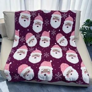 Couverture de Noël duveteuse avec motif de Père Noël et flocons pour un cadeau festif.