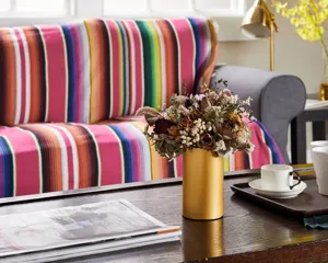 Mexican style colorful striped blanket throw for indoor sofa and outdoor picnic beach decoration.