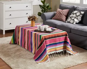 Detailed view of a vibrant Mexican striped blanket used as a colorful table runner or throw.