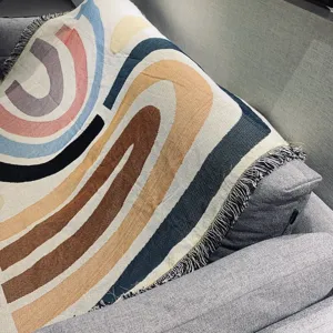 Nordic knitted throw blanket with abstract geometric arch design for cozy sofa and home decor.