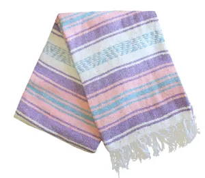 Mexican style woven blanket with geometric stripes and tassels, perfect for beach and home decor.