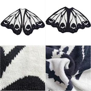 Bat wing knit cape detail shot showing soft texture and unique Halloween cloak design.