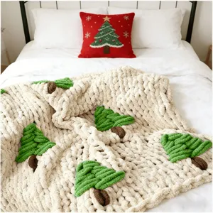 Cozy chunky knit throw blanket with cute Christmas tree patterns for winter home decor.