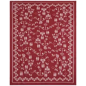 Red knitted jacquard blanket with white Christmas holiday patterns, soft sofa throw and gift item.