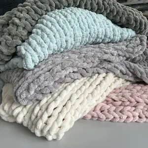 Chunky knit chenille blanket detail shot, soft handmade throw blanket texture in multi colors.