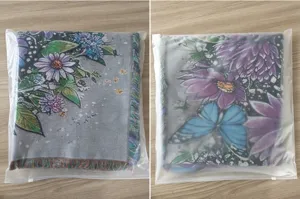 Close up of woven jacquard blanket with butterfly floral pattern folded in package.