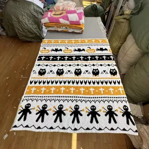 Detailed view of the Halloween pattern knitted jacquard blanket, soft texture for home decor.