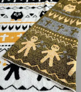 Knit jacquard blanket detail showing soft chenille texture and vintage patterns for cozy sofa decor.