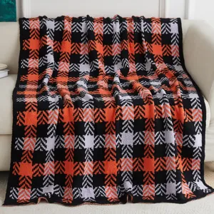 Cozy knitted jacquard throw blanket with stylish plaid pattern, soft sofa blanket for home decor.
