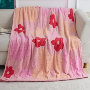 Cozy pink knit floral throw blanket for sofa, soft plush fluffy aesthetic blanket for home decor.
