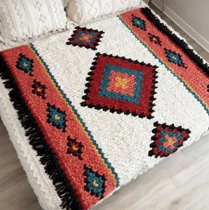 Handmade chunky knit throw blanket with bohemian diamond pattern, cozy chenille decor.