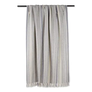 Plaid tissé en jacquard avec franges et rayures ethniques pour décoration de lit.