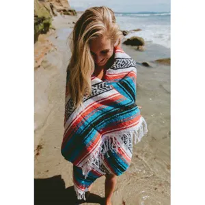 Detail view of colorful Mexican geometric stripe blanket, perfect beach mat or yoga blanket.