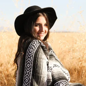 Mexican geometric patterned woven throw blanket, cozy outdoor boho style soft blanket decor.