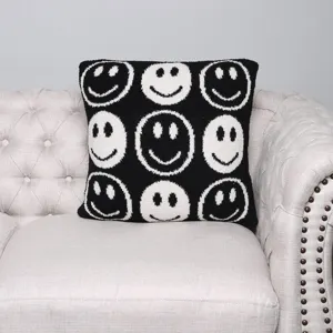Knitted jacquard throw pillow cover with cute black and white smiley face pattern for sofa.