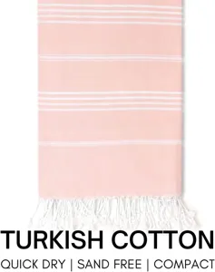 Pink white striped Turkish beach towel detail, fringe design, quick dry compact material.