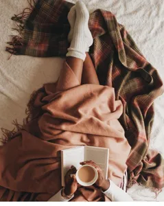 Cozy merino wool throw blanket for bedroom and living room warm winter home decor styling.