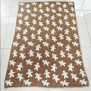 Brown gingerbread man pattern blanket, cozy winter sofa throw for home and office use.