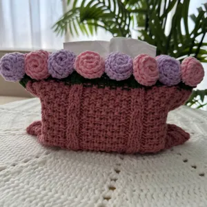 Handcrafted crochet tissue box cover detail, pink rose floral design for home decor.