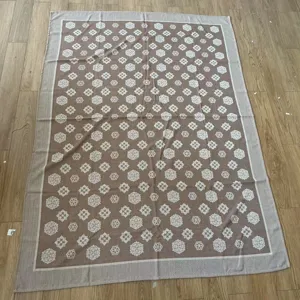 Detailed close-up view of the elegant brown patterned summer cooling blanket and nap throw.