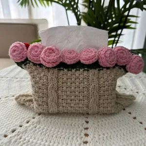 Handmade knitted tissue box cover with pink crochet roses cozy home decor detail shot
