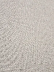 Unbleached woven fabric detail closeup, premium texture for custom beach towel and bath textile.