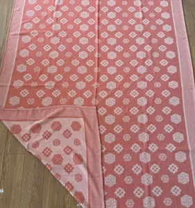 Pink floral summer cooling blanket, elegant medallion pattern, soft textile quilt for daily nap use.