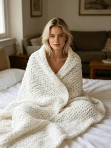 Cozy chunky knit blanket detail shot showing soft chenille texture for couch and bedroom decor.