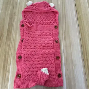Knit baby sleeping bag with hood and cute ears, soft pink swaddle blanket for infants and toddlers.