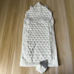 Knit baby sleeping bag detail view, white double-layer fleece swaddle blanket with cute hood.