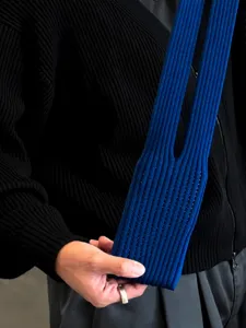 Blue ribbed knit phone bag, stylish long knitted pouch accessory for daily wear.