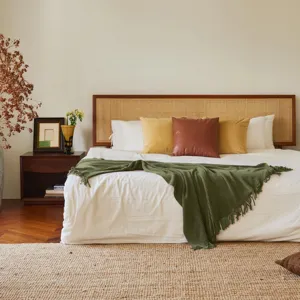 Green knitted waffle throw blanket for cozy bedroom decor, soft sofa bed blanket use.
