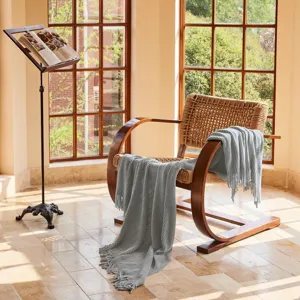 Gray knitted throw blanket for sofa, cozy fringe blanket for living room decor and daily use.