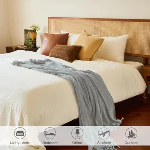 Grey knitted throw blanket for sofa and bed, soft texture, cozy home decor detail view.