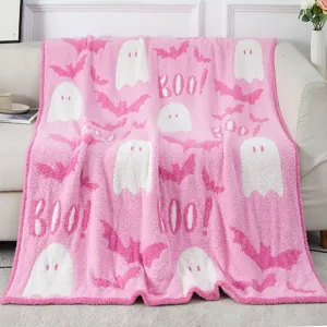 Pink ghost bat pattern knit throw blanket detail showing cozy texture and festive theme.
